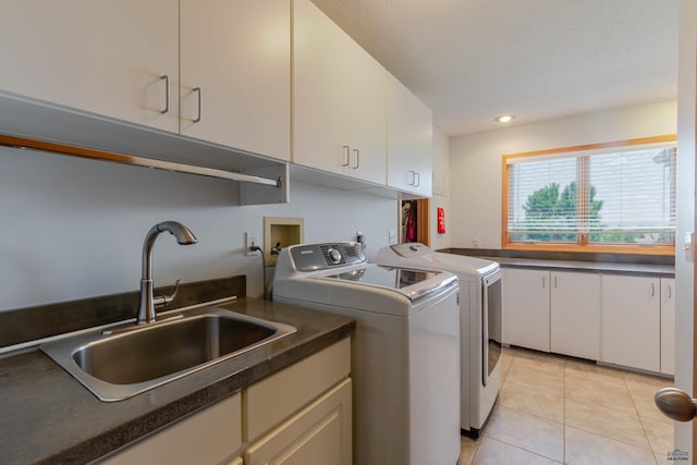 4941 Springtree Ct, Rapid City, SD 57702 - laundry area with cabinet space, washer and dryer, light tile patterned floors, and recessed lighting