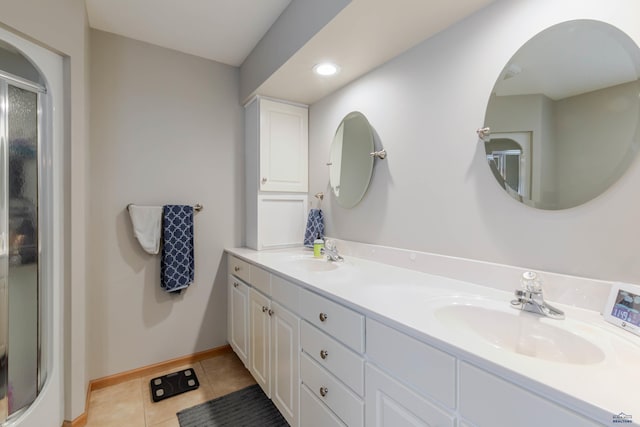 4941 Springtree Ct, Rapid City, SD 57702 - full bathroom with tile patterned floors, double vanity, a shower with shower door, and recessed lighting