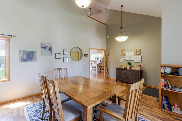 4941 Springtree Ct, Rapid City, SD 57702 - dining room featuring light wood-style flooring, high vaulted ceiling, and ceiling fan