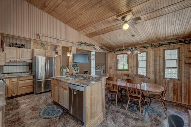 12525 Jax Ct, Rapid City, SD 57701 - kitchen featuring stainless steel appliances, wood ceiling, light brown cabinetry, a ceiling fan, and wood walls