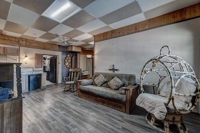 12525 Jax Ct, Rapid City, SD 57701 - living room with a drop ceiling, a ceiling fan, and light wood-style flooring
