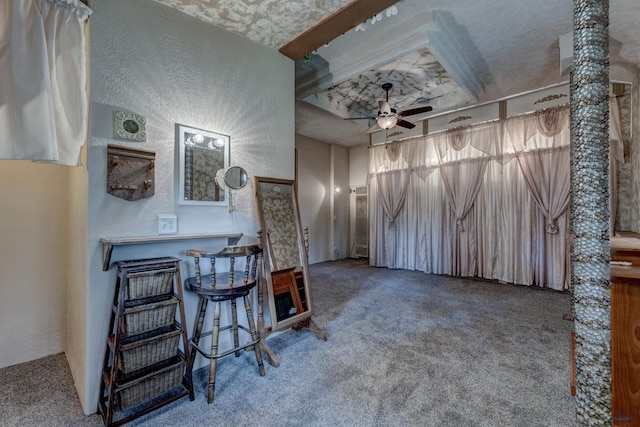 12525 Jax Ct, Rapid City, SD 57701 - living room featuring carpet floors, a ceiling fan, a textured wall, and a dry bar