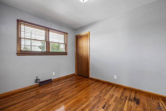 113 E Custer St, Rapid City, SD 57701 - empty room featuring wood finished floors and baseboards