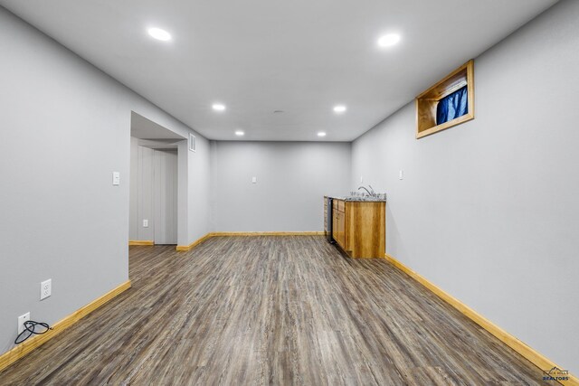 113 E Custer St, Rapid City, SD 57701 - unfurnished room featuring recessed lighting, wood finished floors, and wet bar