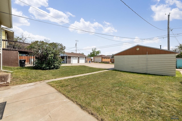 113 E Custer St, Rapid City, SD 57701 - view of green lawn with a garage