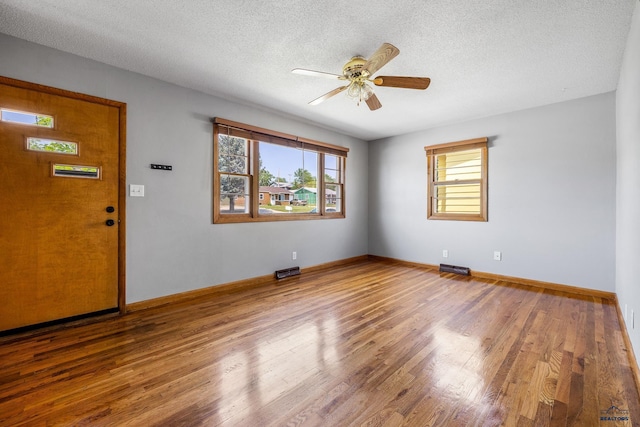 113 E Custer St, Rapid City, SD 57701 - spare room featuring wood finished floors, ceiling fan, and a textured ceiling