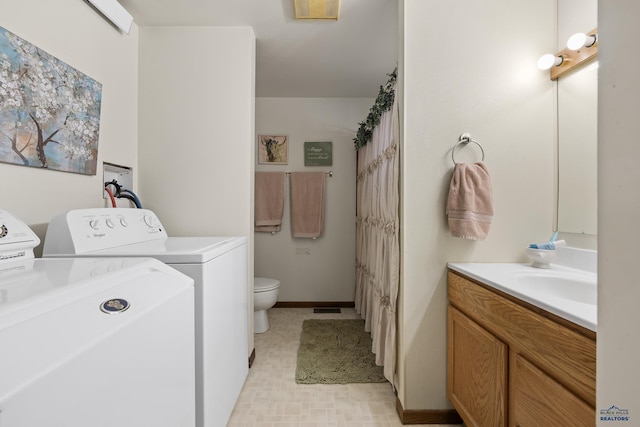 5400 Cedar Dr, Black Hawk, SD 57718 - washroom with washer and clothes dryer and baseboards