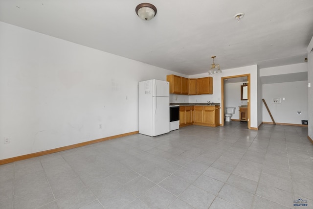 5400 Cedar Dr, Black Hawk, SD 57718 - unfurnished living room featuring a chandelier and light tile patterned flooring