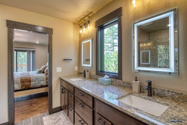 20746 Monte Carlo Rd, Lead, SD 57754 - ensuite bathroom featuring double vanity and a textured wall