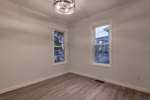 807 Addie St Unit 807Upper, Addie, Lead, SD 57754 - unfurnished room featuring wood finished floors and a chandelier