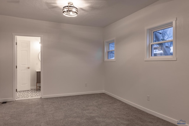 807 Addie St Unit 807Upper, Addie, Lead, SD 57754 - empty room with carpet floors and a textured ceiling