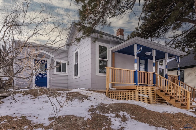 807 Addie St Unit 807Upper, Addie, Lead, SD 57754 - view of front of house with a porch and a chimney