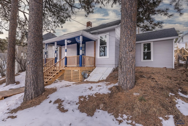 807 Addie St Unit 807Upper, Addie, Lead, SD 57754 - view of front of home with a chimney and covered porch