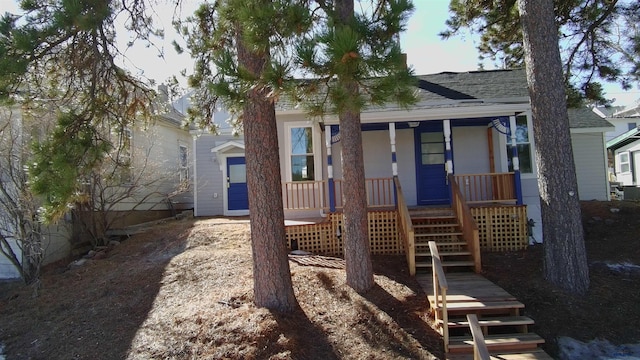 807 Addie St Unit 807Upper, Addie, Lead, SD 57754 - view of front facade featuring a shingled roof, covered porch, and stairs