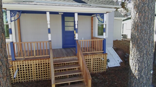 807 Addie St Unit 807Upper, Addie, Lead, SD 57754 - doorway to property featuring a shingled roof and covered porch