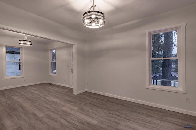 807 Addie St Unit 807Upper, Addie, Lead, SD 57754 - spare room featuring a chandelier and dark wood-type flooring