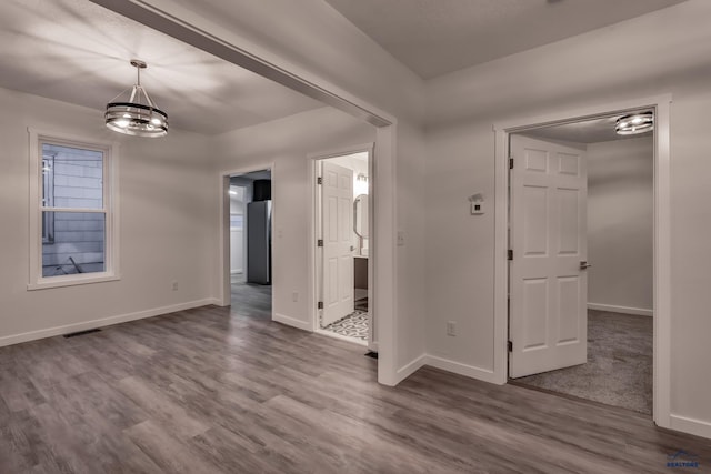 807 Addie St Unit 807Upper, Addie, Lead, SD 57754 - empty room with a chandelier and dark wood-style flooring