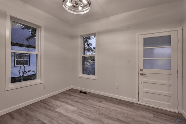 807 Addie St Unit 807Upper, Addie, Lead, SD 57754 - unfurnished dining area featuring wood finished floors and a chandelier