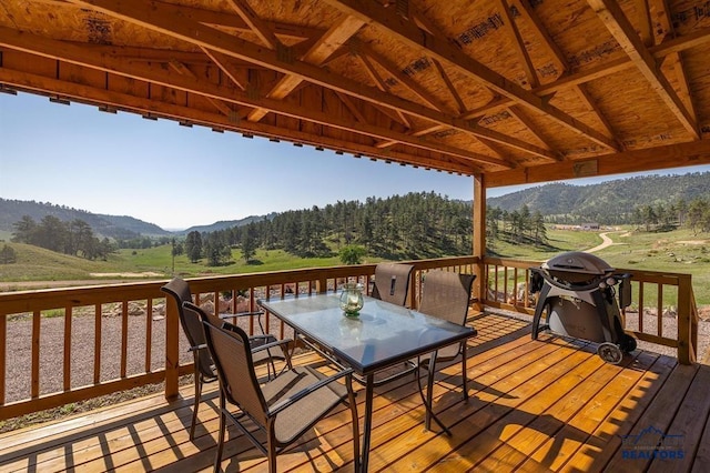 28085 Hargins Rd, Hot Springs, SD 57747 - wooden deck featuring a mountain view, outdoor dining area, and area for grilling