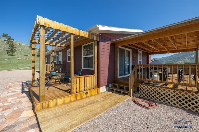 28085 Hargins Rd, Hot Springs, SD 57747 - wooden terrace with an outdoor fire pit and a mountain view