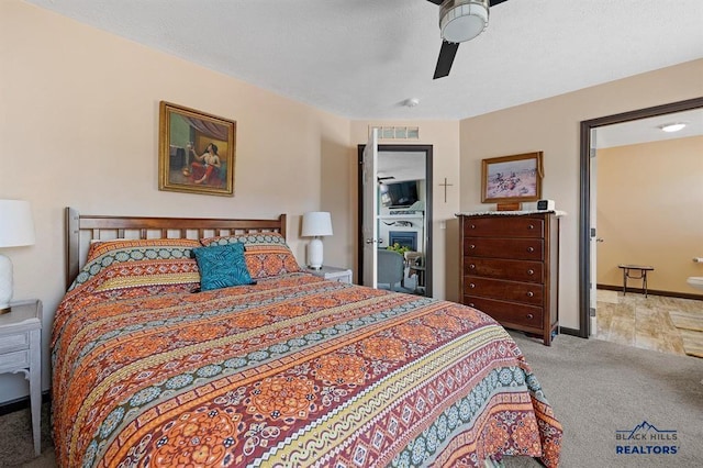 28085 Hargins Rd, Hot Springs, SD 57747 - carpeted bedroom with a ceiling fan and baseboards