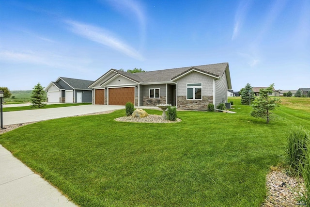4519 Jolly Ln, Rapid City, SD 57701 - ranch-style home featuring stone siding, an attached garage, driveway, and a front lawn