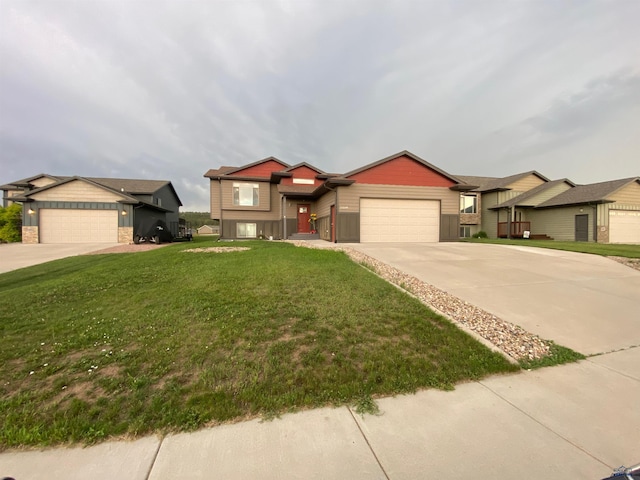 10049 Kaelem Ct, Summerset, SD 57718 - view of front of house featuring concrete driveway, an attached garage, and a front lawn