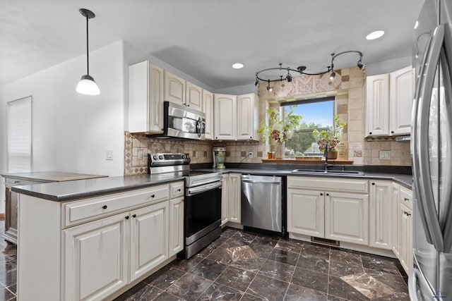 6401 Mountain Meadow Rd, Black Hawk, SD 57718 - kitchen with stainless steel appliances, dark countertops, a peninsula, decorative backsplash, and recessed lighting