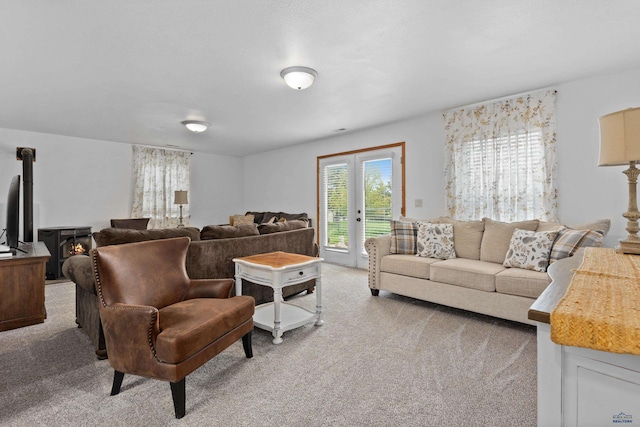 6401 Mountain Meadow Rd, Black Hawk, SD 57718 - living area featuring carpet flooring, french doors, and a wood stove