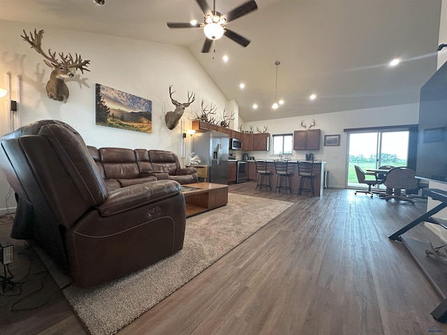 215 Aurora Ave, Spearfish, SD 57783 - living area featuring dark wood finished floors, ceiling fan, vaulted ceiling, and recessed lighting