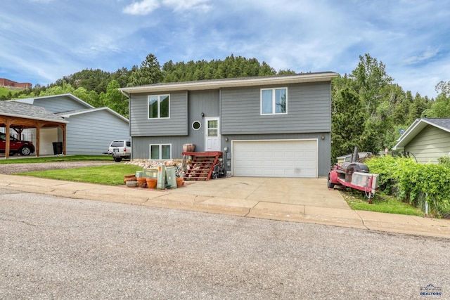 20 Mcmasters Dr, Deadwood, SD 57732 - split foyer home with a garage and driveway