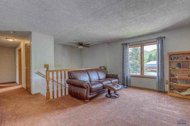 20 Mcmasters Dr, Deadwood, SD 57732 - living room with carpet flooring, a ceiling fan, and a textured ceiling