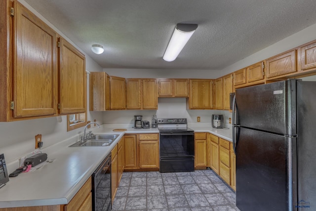 20 Mcmasters Dr, Deadwood, SD 57732 - kitchen featuring black appliances, light countertops, a textured ceiling, and stone finish floors