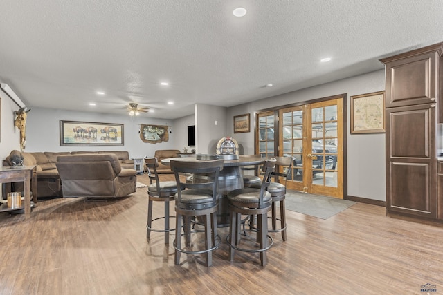 5642 Bob Ln, Black Hawk, SD 57718 - dining space featuring recessed lighting, ceiling fan, light wood-style flooring, a textured ceiling, and french doors