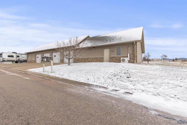 5642 Bob Ln, Black Hawk, SD 57718 - view of front of home featuring a garage, stone siding, and concrete driveway