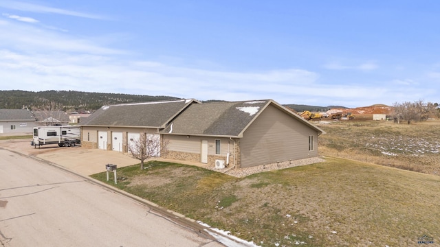 5642 Bob Ln, Black Hawk, SD 57718 - view of front of house with driveway, a front yard, a garage, and stone siding