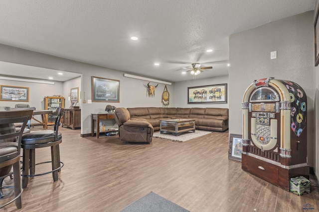 5642 Bob Ln, Black Hawk, SD 57718 - living area with wood finished floors, recessed lighting, a ceiling fan, and a textured ceiling