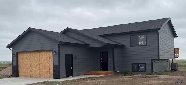 405 Constitution Blvd, Box Elder, SD 57719 - view of front of property with a garage, driveway, and roof with shingles