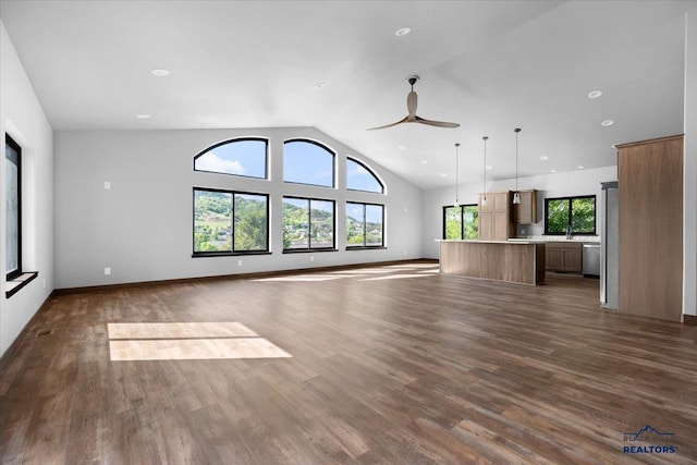 231 Powderhorn Unit 231Powderhorn, Court, Spearfish, SD 57783 - unfurnished living room with a ceiling fan, dark wood finished floors, vaulted ceiling, and recessed lighting