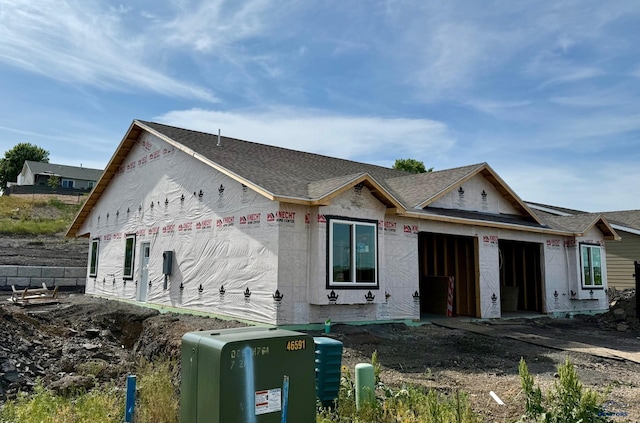 2527 Hennessy Dr, Rapid City, SD 57701 - view of front facade featuring a garage and a shingled roof