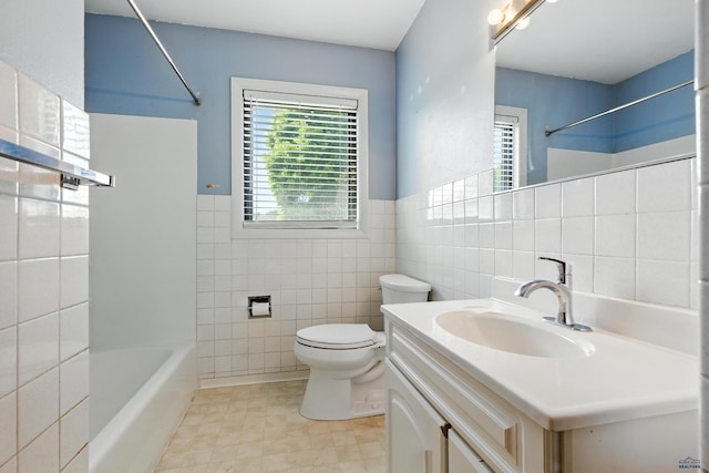 4340 Timothy, Rapid City, SD 57702 - full bathroom with tile walls, vanity, shower / bathtub combination, a wainscoted wall, and tile patterned flooring