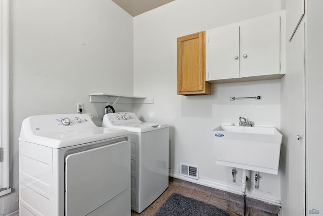 4340 Timothy, Rapid City, SD 57702 - washroom featuring cabinet space and washer and clothes dryer