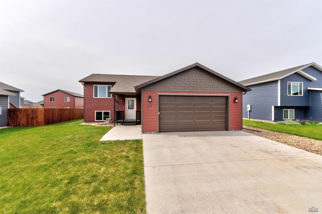 613 Civil Way, Box Elder, SD 57719 - split level home featuring a garage and concrete driveway