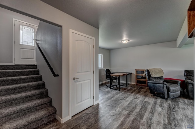 613 Civil Way, Box Elder, SD 57719 - sitting room with wood finished floors, healthy amount of natural light, and stairway
