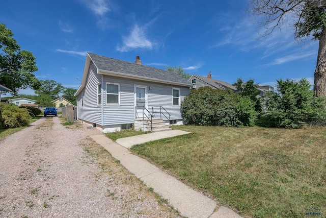 911 Haines Ave, Rapid City, SD 57701 - rear view of property with gravel driveway, a chimney, and a shingled roof