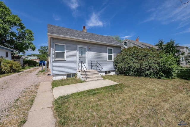 911 Haines Ave, Rapid City, SD 57701 - view of front of house featuring a front yard and a chimney