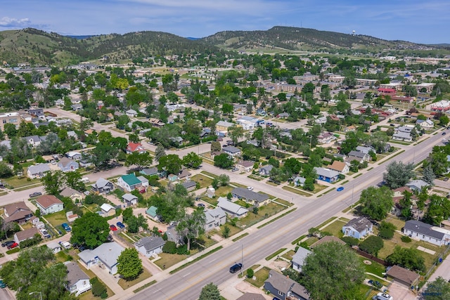 911 Haines Ave, Rapid City, SD 57701 - aerial overview of property's location featuring a mountain backdrop and nearby suburban area