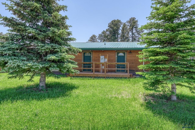 20813 Legends Ln, Sturgis, SD 57785 - view of front of house with a deck, a metal roof, and faux log siding