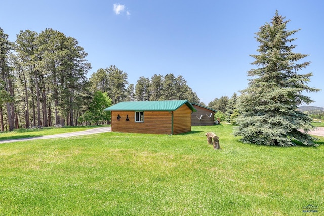 20813 Legends Ln, Sturgis, SD 57785 - view of home's exterior featuring a yard, an outbuilding, and driveway