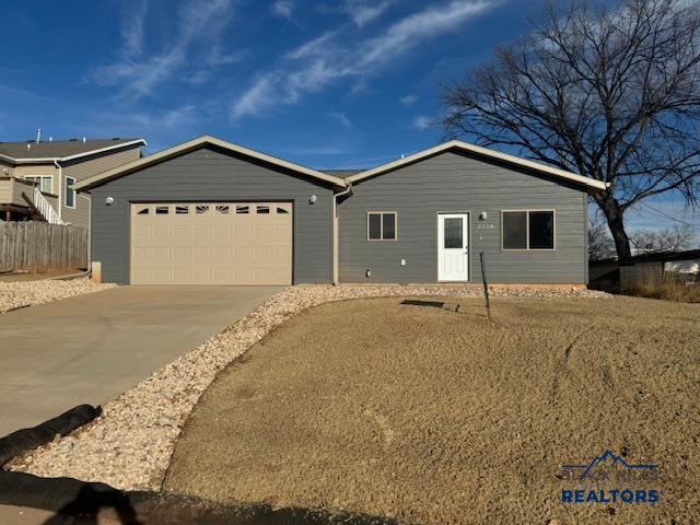 3226 W Rapid, Rapid City, SD 57702 - ranch-style home with driveway and a garage